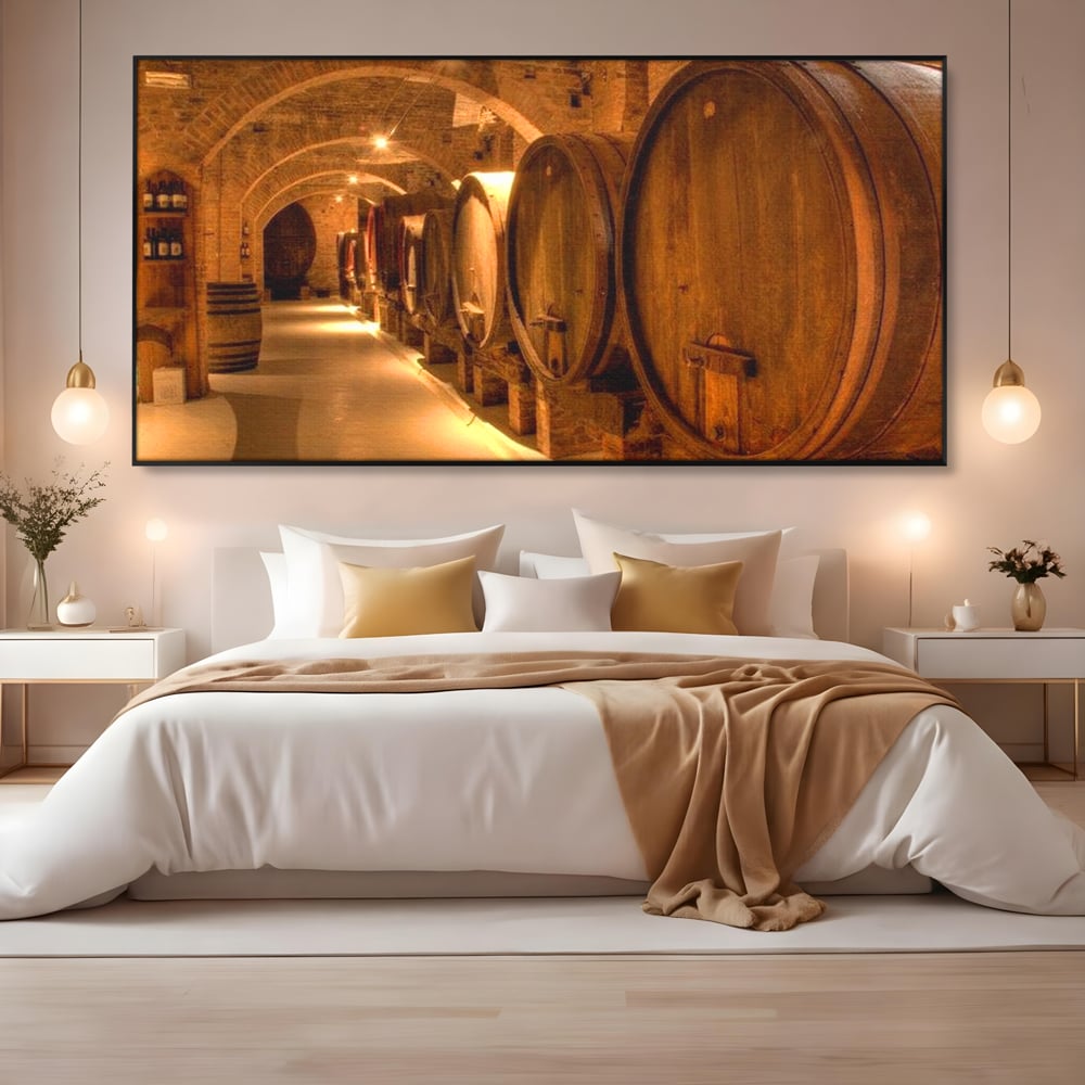 Tablou canvas cu tablou canvas cu butoaie de vin in crama, in rama de aluminiu negru, pe perete intr-un dormitor